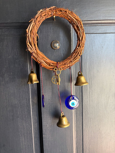 Evil eye door protectant with bells